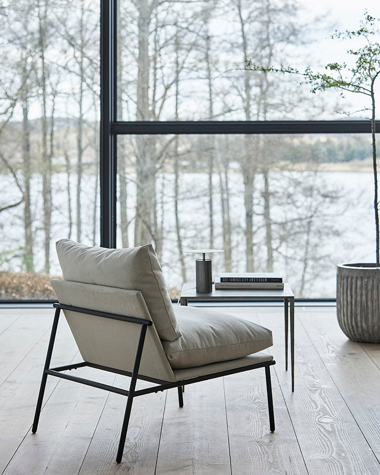 Lounge chair with sand coloured cushions