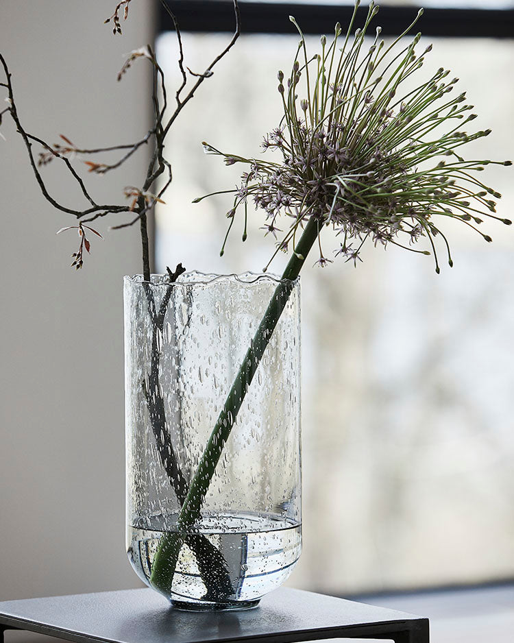 Glass vase in a light grey colour with air bubbles