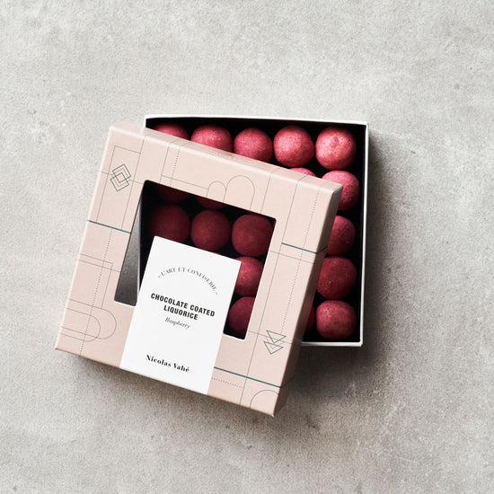 Chocolate coated liquorice, raspberry