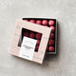 Chocolate coated liquorice, raspberry