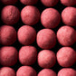 Chocolate coated liquorice, raspberry